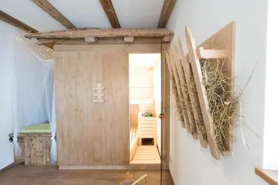 a hallway with a wooden door in a room at Unterthurnerhof in Rifiano