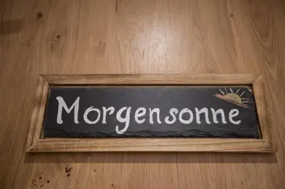 a chalkboard with the word morgan sonic written on it at Unterthurnerhof in Rifiano