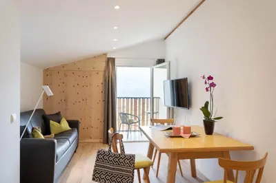 a living room with a couch and a table at MeranoView Apartments in Marlengo