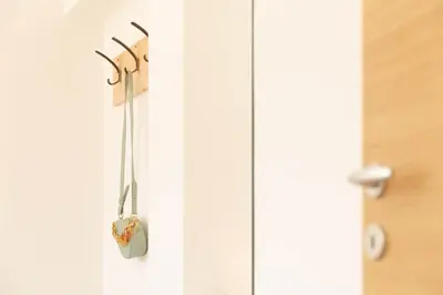 a pair ofabinets hanging on a white wall at MeranoView Apartments in Marlengo
