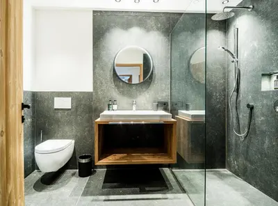 a bathroom with a toilet and a sink and a shower at Mi Coa in Santa Cristina in Val Gardena