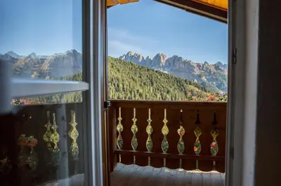 a window with a view of a mountain at Residence Bergblick in Bressanone
