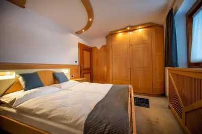 a bedroom with a large bed in a room at Apartment Sellablick in Ortisei