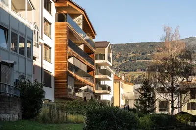 an apartment building with balconies on the side of it at Gerharts Premium City Living - center of Brixen with free parking and Brixencard in Bressanone