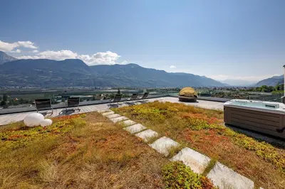 a house with a view of the mountains at Ferienhaus Törggelehof in Cermes