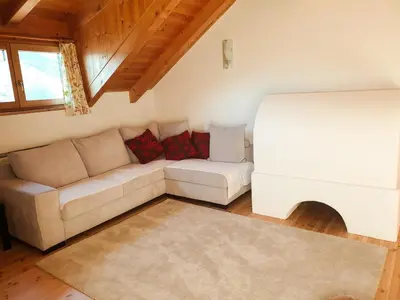 a living room with a couch and a bed at Birbamergut in Longomoso