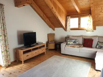 a living room with a couch and a tv at Birbamergut in Longomoso