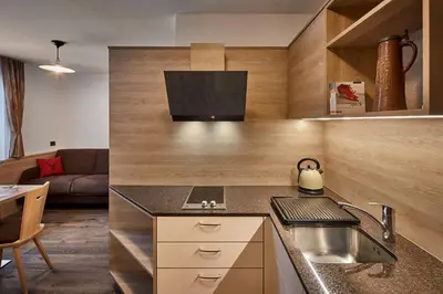 a kitchen with a sink and a counter top at Saina in Colfosco