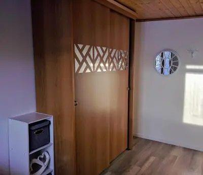 a room with a wooden door and a window at Regina del Bosco della vicina Cavalese in Daiano