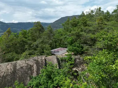a campsite on top of a mountain with trees at VILLA COLLINA VERDE in Bolzano