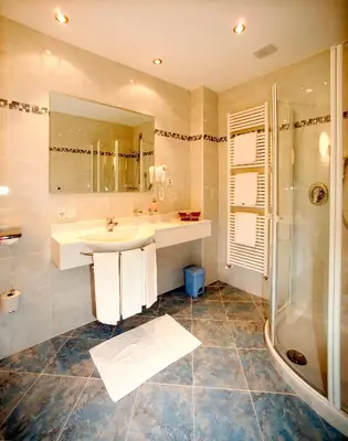 a bathroom with a sink and a shower at Residence Palmai in Ortisei