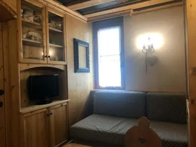 a house on a hill with a view of a town at Cortina Olympic Suite in Cortina dʼAmpezzo