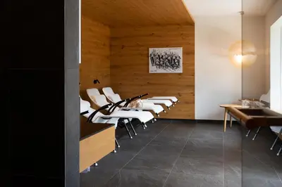 a row of white chairs in a waiting room at Kronplatz Ski Lodge in Valdaora