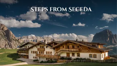 a house in the mountains with the words steps from secedbia at Almhotel Col Raiser in Santa Cristina in Val Gardena