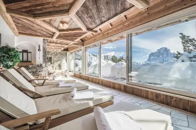a hotel room with a view of the mountains at Almhotel Col Raiser in Santa Cristina in Val Gardena