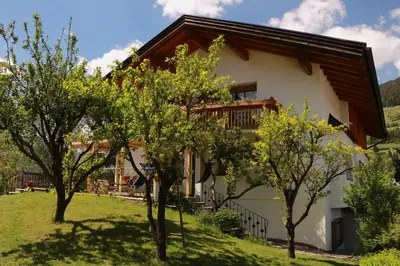 a house with trees in front of it at B&B Frühlingsheim in Racines