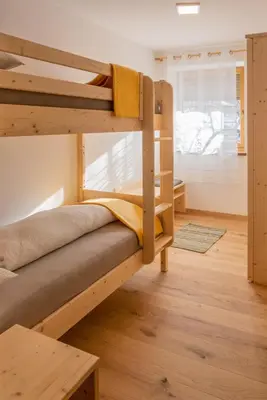 a bedroom with two bunk beds in a room at B&B Frühlingsheim in Racines