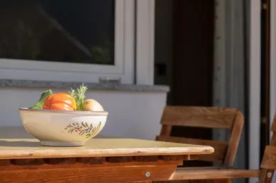 a bowl of vegetables sitting on a table at Rabland Haus Texel I in Parcines