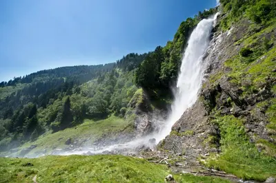 a waterfall on the side of a mountain at Ferienwohnung im Haus Texel IV in Parcines