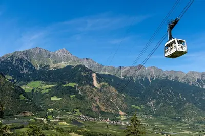a gondola ride over a mountain valley at Ferienwohnung im Haus Texel IV in Parcines