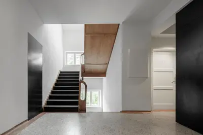 a hallway with a staircase in a house at Casa al Sole in Ortisei