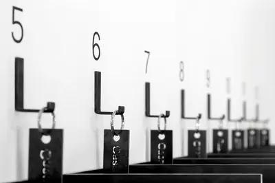 a row of black lights lined up against a wall at Casa al Sole in Ortisei