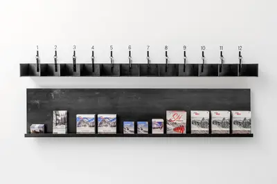 a shelf with a bunch of books on it at Casa al Sole in Ortisei