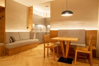 a living room with a couch and a table at Ladurner Suites in Merano