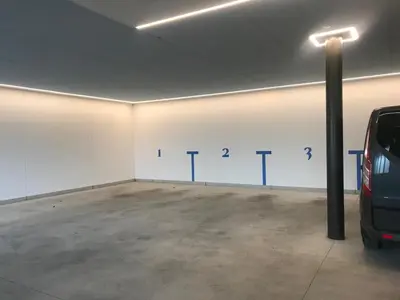 a parking garage with a car parked in it at Oberpalwitterhof in Barbiano