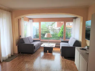 a living room with two couches and a table at Ciasa Pascal in San Vigilio
