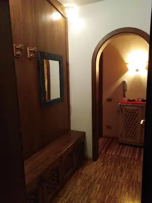 an entrance to a hallway with a mirror and a door at Ciasa Pascal in San Vigilio