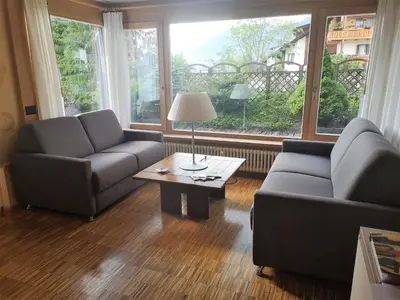 a living room with two couches and a coffee table at Ciasa Pascal in San Vigilio