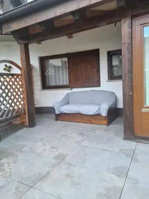 a bedroom with a bed in the corner of a room at Ciasa Pascal in San Vigilio