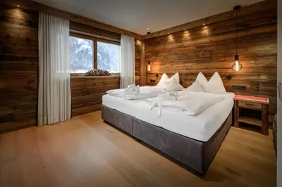 a kitchen with a table and a balcony at Apartment Scurcià 41 in Ortisei