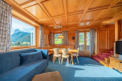 a living room with a couch and a table at Villa Suredl in Ortisei