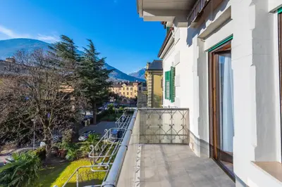 a balcony with a view of a city at Lara's Guesthouse in Merano