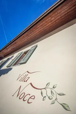 a sign on the side of a building with the words kill notnea at Villa Noce 2 in Tesero