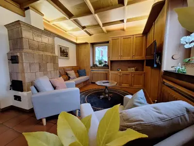 a living room with a couch and a fireplace at Villa Noce 2 in Tesero