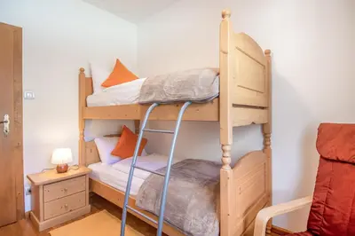 a couple of bunk beds in a room at Villa Noce 2 in Tesero