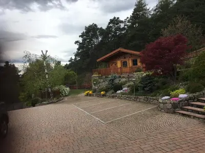 a brick parking lot with a house in the background at App. Eichenheim in Fiè