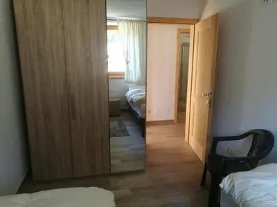 a living room with a couch and a window at Ca DaSa in San Lugano