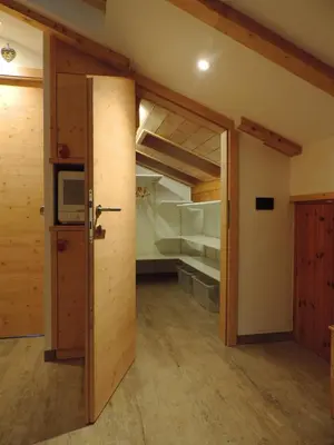 an open door to a room with a bunk bed at incantevole mansarda in val di Fassa in Alba di Canazei