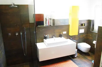 a living room with a couch and a table at Relax Suite in Merano