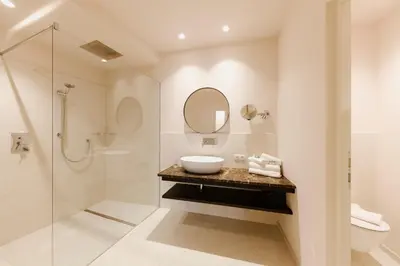 a bathroom with a sink and a shower at Ansitz am Eck by Hotel Pernhof in Termeno