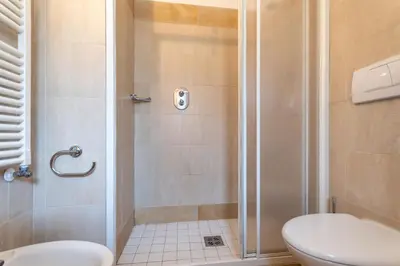 a bathroom with a shower with a toilet at Casa Rosi in Pozza di Fassa