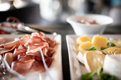 two plates with different types of food on them at Gfell in Vols am Schlern