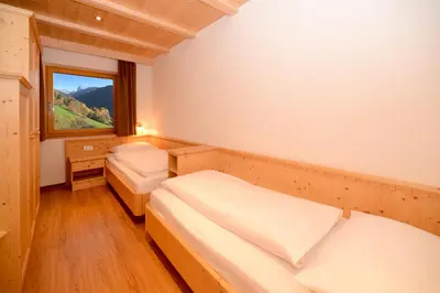 a bedroom with two beds and a window at Appartment Kirch Neuhaus in Laion