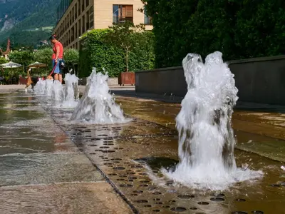 a group of water fountains in a park at Apartments Sabine G in Merano