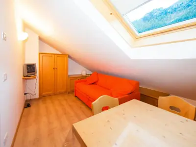 a building with snow in front of it at Apartment Enrosadira-7 by Interhome in Alba di Canazei