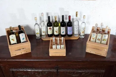 a group of bottles of wine sitting on a table at Agritur al Canyon in Cloz